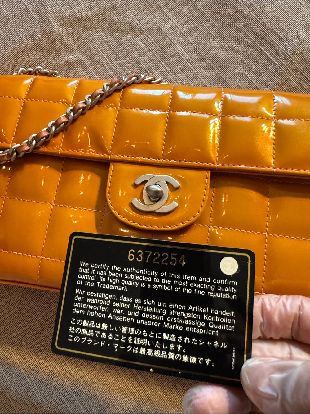 CHANEL Quilted Patent Leather Shoulder Bag in Bright Orange